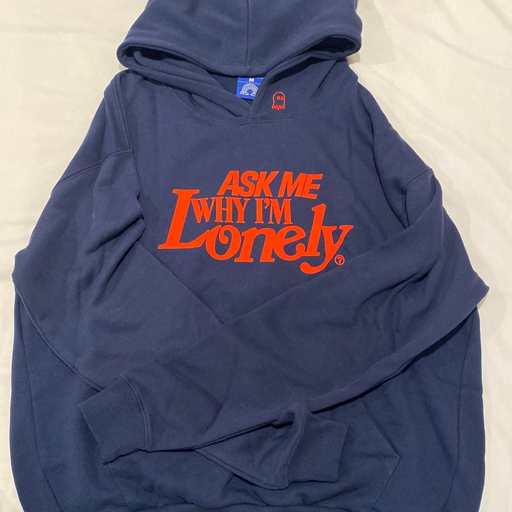 Navy blue with red writing, size medium
